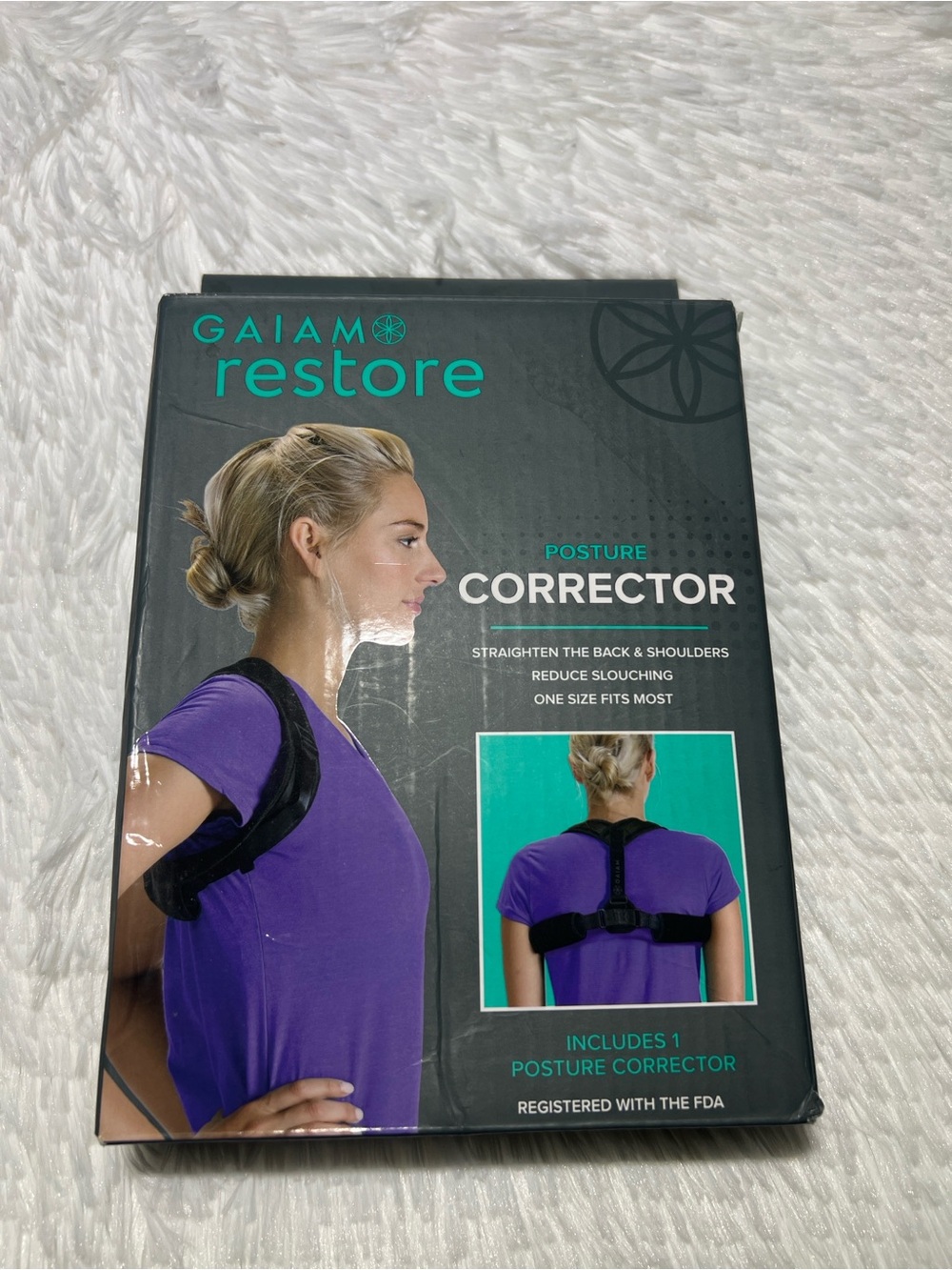 GAIAM Posture Corrector Packaged in Teal and Black